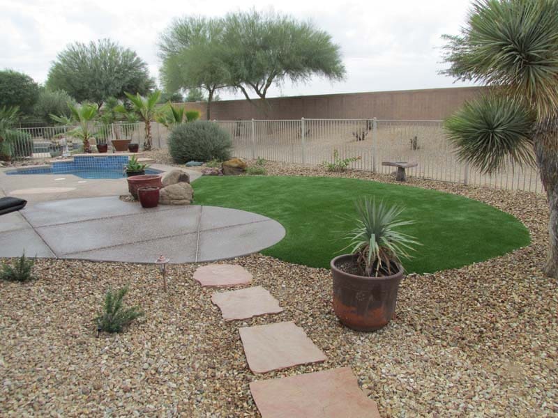 In Arizona, changing seasons bring lower temperatures that are great for enjoying the outdoors. However, given the dramatic difference between highs of more than 100 degrees in the summer and lows that can dip below freezing in the winter, these changes result in a need to change lawn types by the season. The Bermuda grass that Arizona grows in spring and summer can’t survive the cold temperatures of winter in the Sonoran Desert. This means that every fall, lawn owners in the Valley need to follow an overseeding procedure that involves reducing fertilizer and water, cutting the Bermuda grass short and seeding the ground with ryegrass. The ryegrass seed then takes time to grow, needing fertilizer and a proper watering schedule to ensure it matures into a lush lawn. This process takes hours of time and maintenance. The grass also looks dead and yellowed as the new lawn grows, leaving landscaping looking unsightly in the interim. After winter ends and transitions to spring, when temperatures at night stay above 65 degrees consistently, the process then needs to be repeated all over again to regrow Bermuda grass. And so goes the use of time and money to keep a natural lawn green year after year in the desert. Artificial turf cuts out all this labor, so landscaping projects look great all year without hours seeding, watering, and fertilizing. November is an ideal time to encourage the switch to synthetic grass. This means less maintenance and reduced water needs as you only need to spray it occasionally to clean the synthetic grass. And no need to replace when the seasons change. Artificial grass can last between seven to 25 years. At Arizona Turf Depot, we offer multiple grass styles to choose from to meet a variety of needs from putting greens to pet areas. Our synthetic grass will transform your Arizona landscaping projects in atriums, yards, sports fields and more by vastly reducing maintenance requirements. Be sure and check for specials, including these fall deals on Libra ($1.20 per square foot), Puppy Paw Spring ($1.10 per square foot), Bermuda Mid ($1.25 per square foot), and Townscape & Standard Pavers ($2.39 per square foot). We are ready to supply the artificial turf you need to help your landscaping clients make the switch. Whether you’re looking for a new football field surface or the perfect shade of green to make a backyard pop, we’ve got something for you. Visit or call Arizona Turf Depot at our West Valley showroom, 14131 N. Rio Vista Blvd., Suite 9, Peoria, AZ 85381 (623) 388-3389, or contact us at our Mesa location, 7645 E. Ray Road, Suite 101, Mesa, AZ 85212, (480) 690-5591. Our experienced team is happy to help you find the right synthetic grass for your needs.